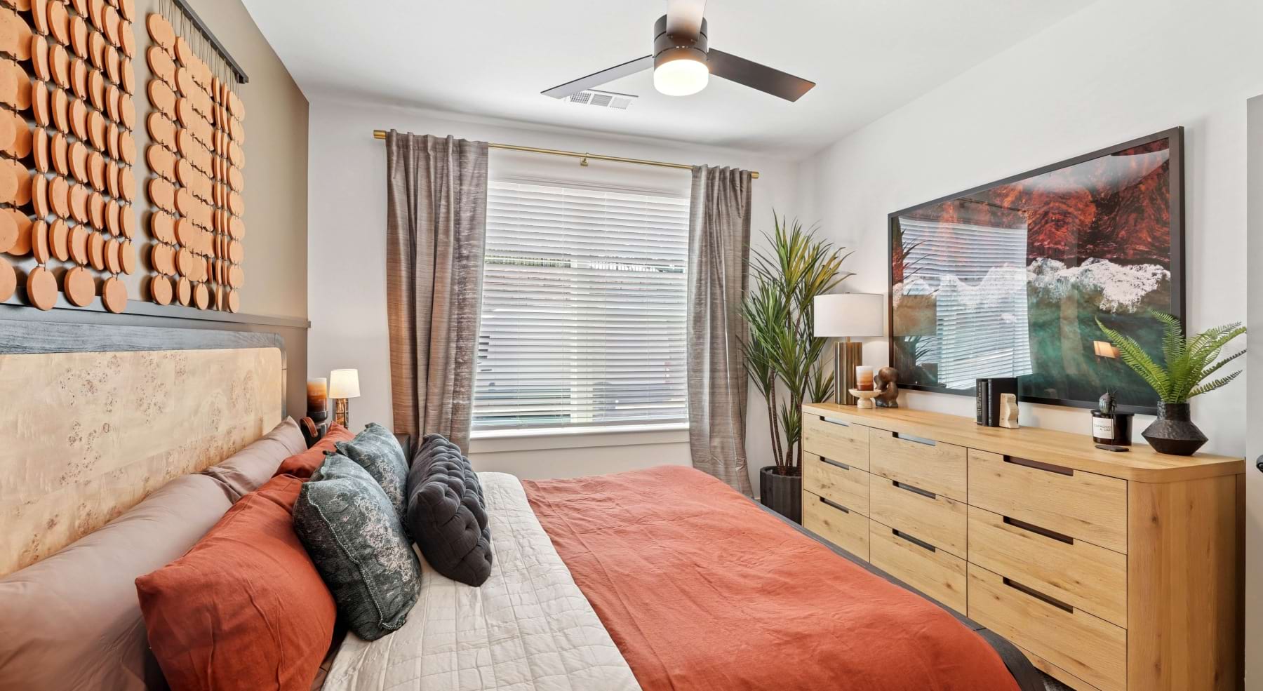 Bedroom with dresser and window at Solis Peachtree Corners apartments for rent