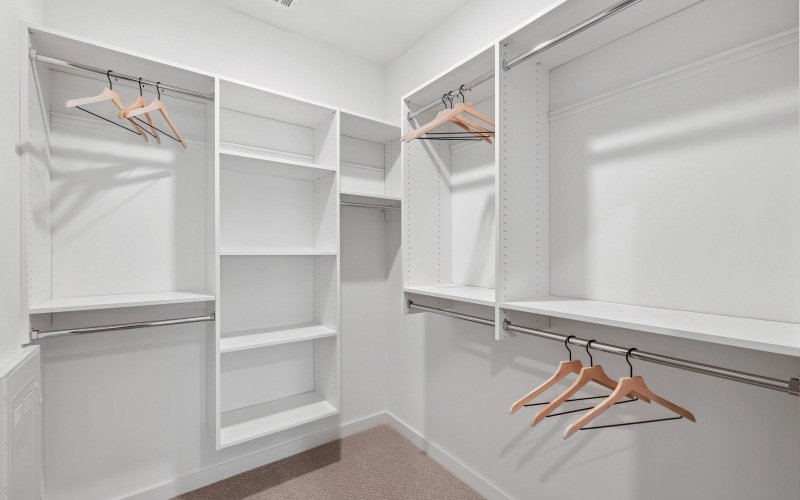 Spacious closets with custom shelving make room for your entire wardrobe (and then some)