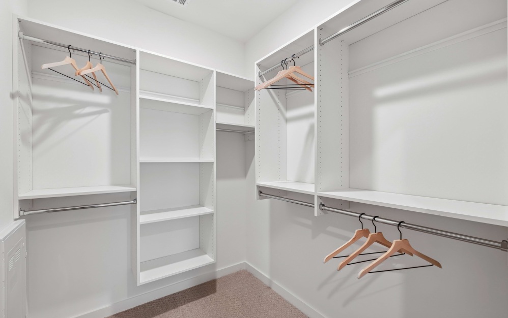 Spacious closets with custom shelving make room for your entire wardrobe (and then some)